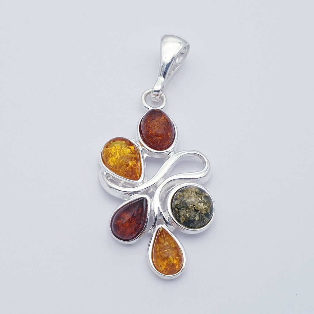 a silver mixed amber pendant