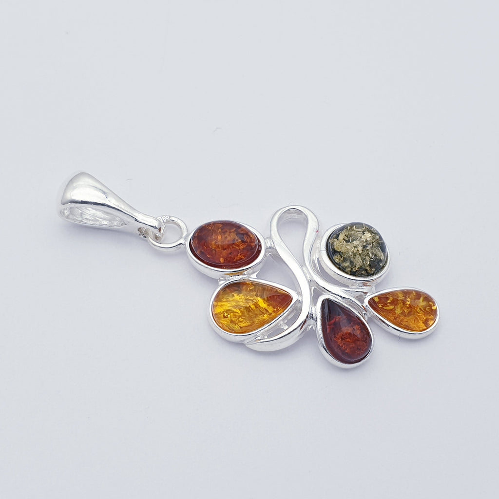 a silver mixed amber pendant