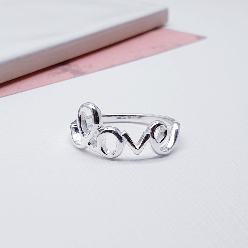 This gorgeous ring features a beautiful Sterling Silver love text, that sits comfortably around the finger. An elegant design and ideal for any occasion.