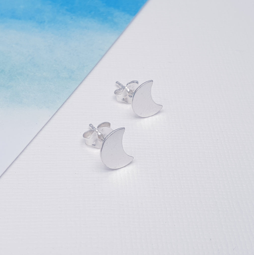 Each stud features a Silver crescent moon that are perfect for everyday wear. These little studs are understated, light on the ear, easy to wear and will add a touch of fun to any outfit. We love celestial jewellery here at Silver Scene and these earrings are one of our favourite designs.