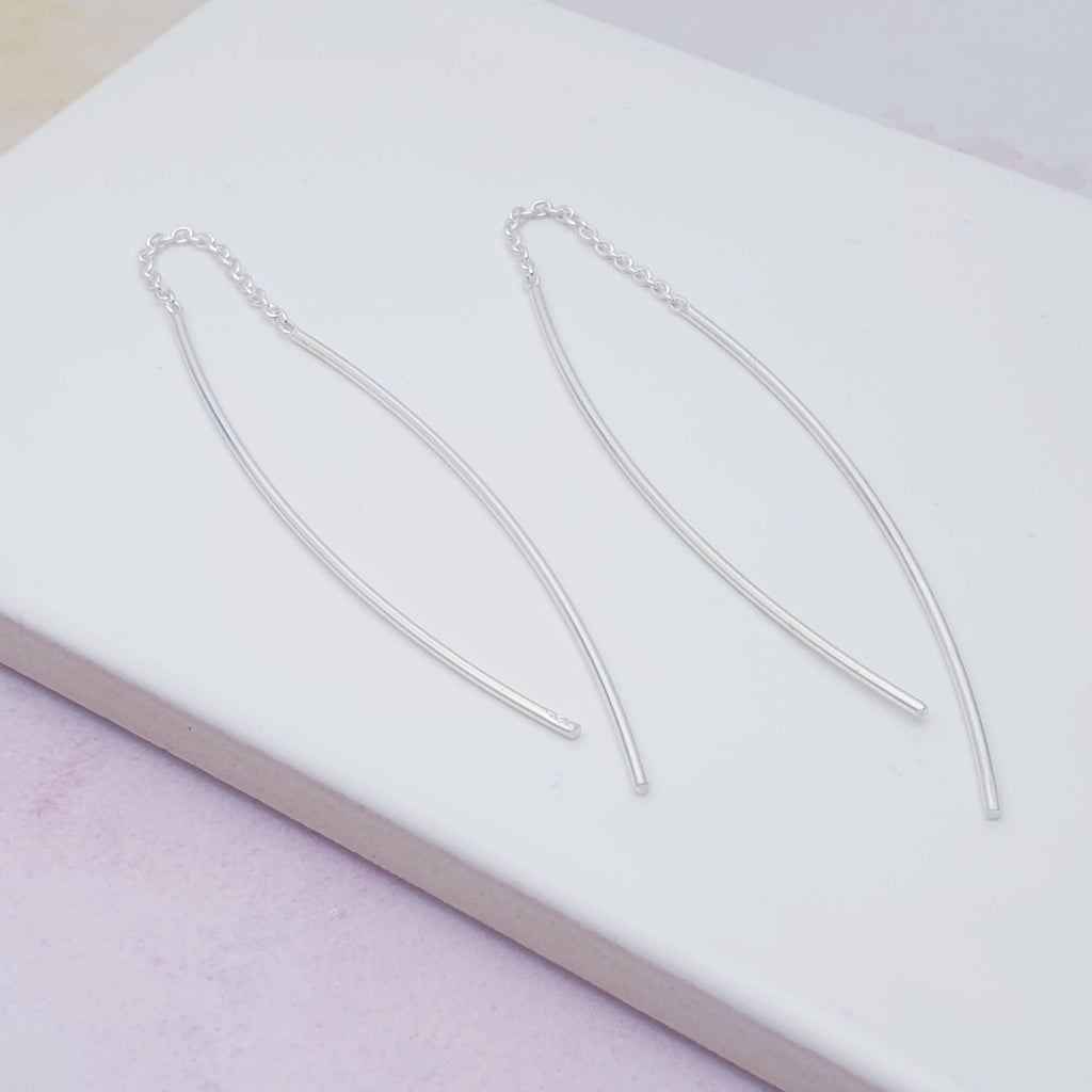 Our Silver Simple Pull Through Earrings are ideal for everyday wear and will transition perfectly from work to play. With a pull through chain that give these earrings a unique look and a touch of elegance these dynamically different earrings are sure to catch the eye.