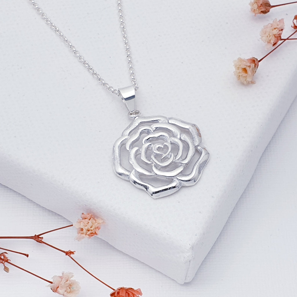 This pendant features a detailed cut out rose design, this adorable pendant is exquisitely feminine and is sure to become an everyday favourite.