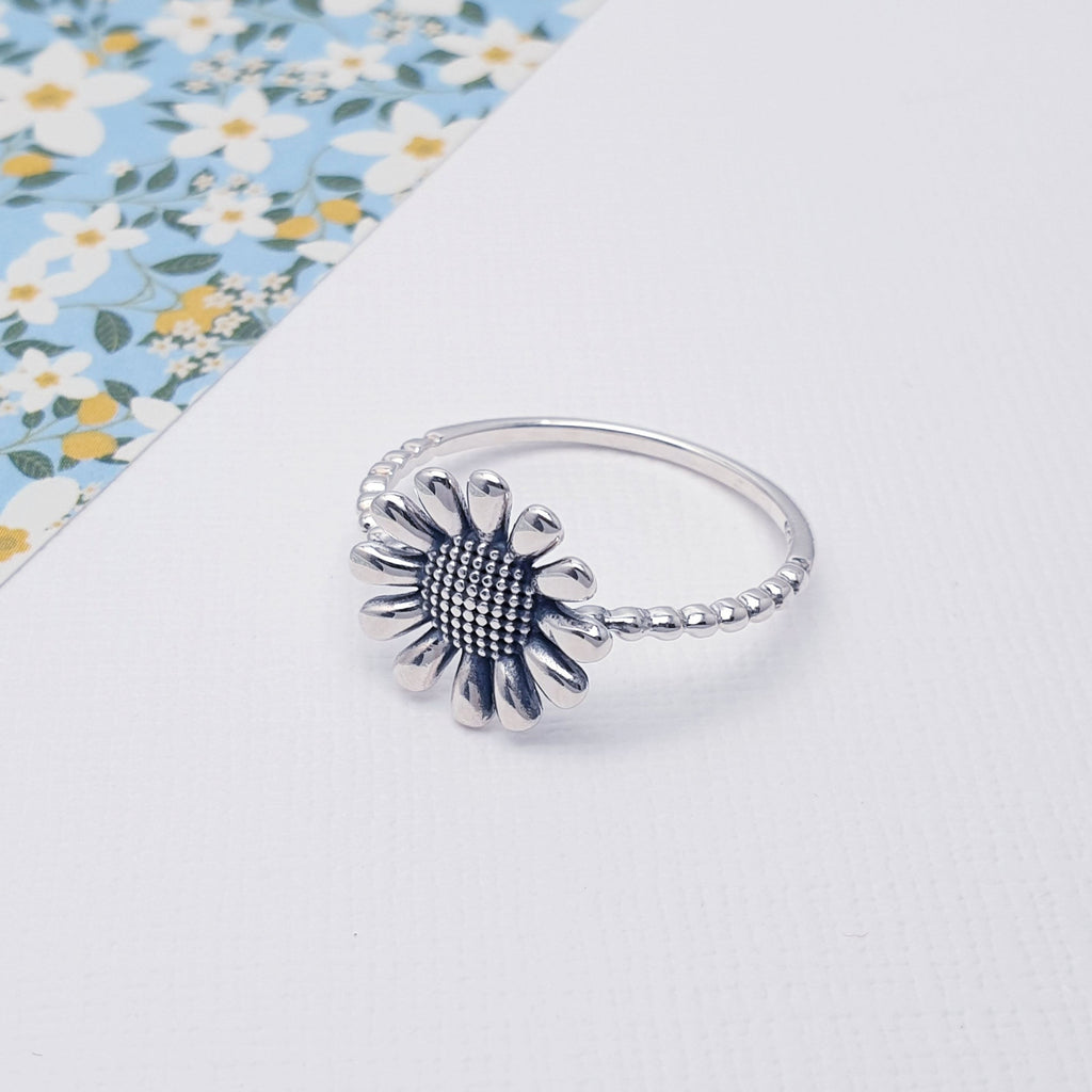 This ring has a delicate and intricate Sterling Silver sunflower design. The oxidised finish gives the design depth and presence.