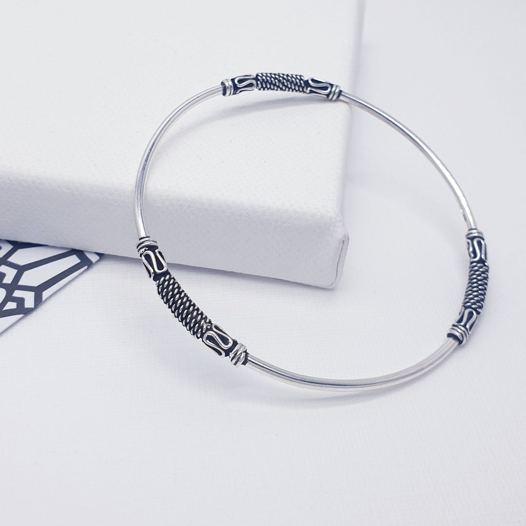 A gorgeous design, this bangle features a Sterling Silver band and three Bali style, oxidised, patterned details. A great addition to any bangle collection. Sometimes less is more, and that is definitely the case with this minimalist design, a popular bangle in all our shops.