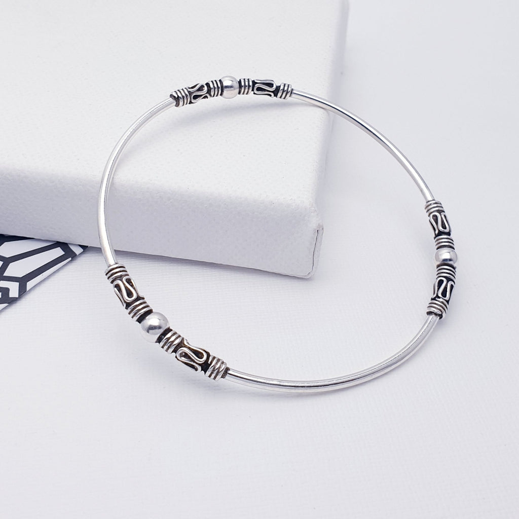 A gorgeous design, this bangle features a Sterling Silver band with three Bali style, oxidised, patterned details. A great addition to any bangle collection. Sometimes less is more, and that is definitely the case with this minimalist design, a popular bangle in all our shops.