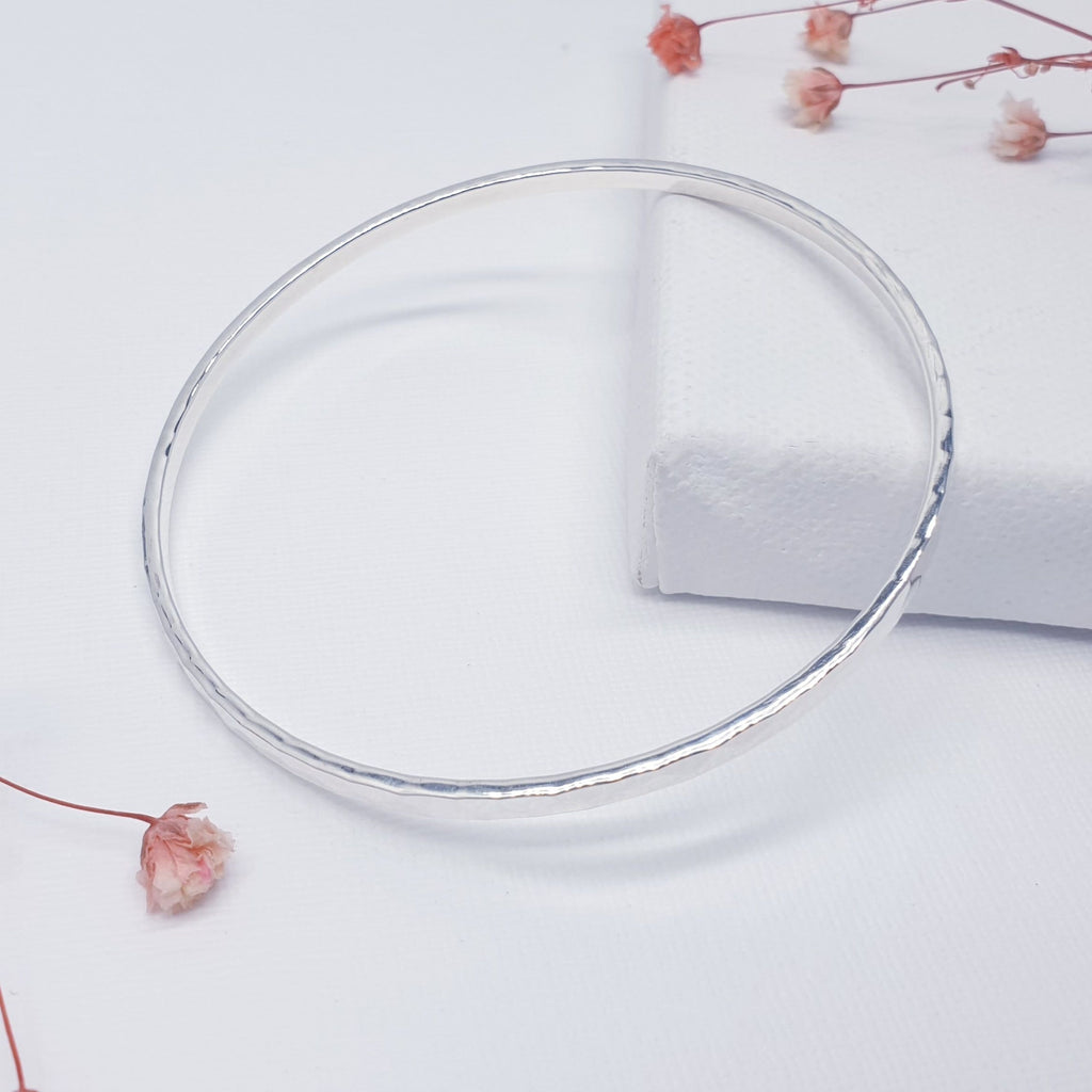 A beautiful design, this cuff bracelet features a Sterling Silver hammered band. A great addition to any bangle collection. Sometimes less is more, and that is definitely the case with this minimalist design, a popular bangle in all our shops.