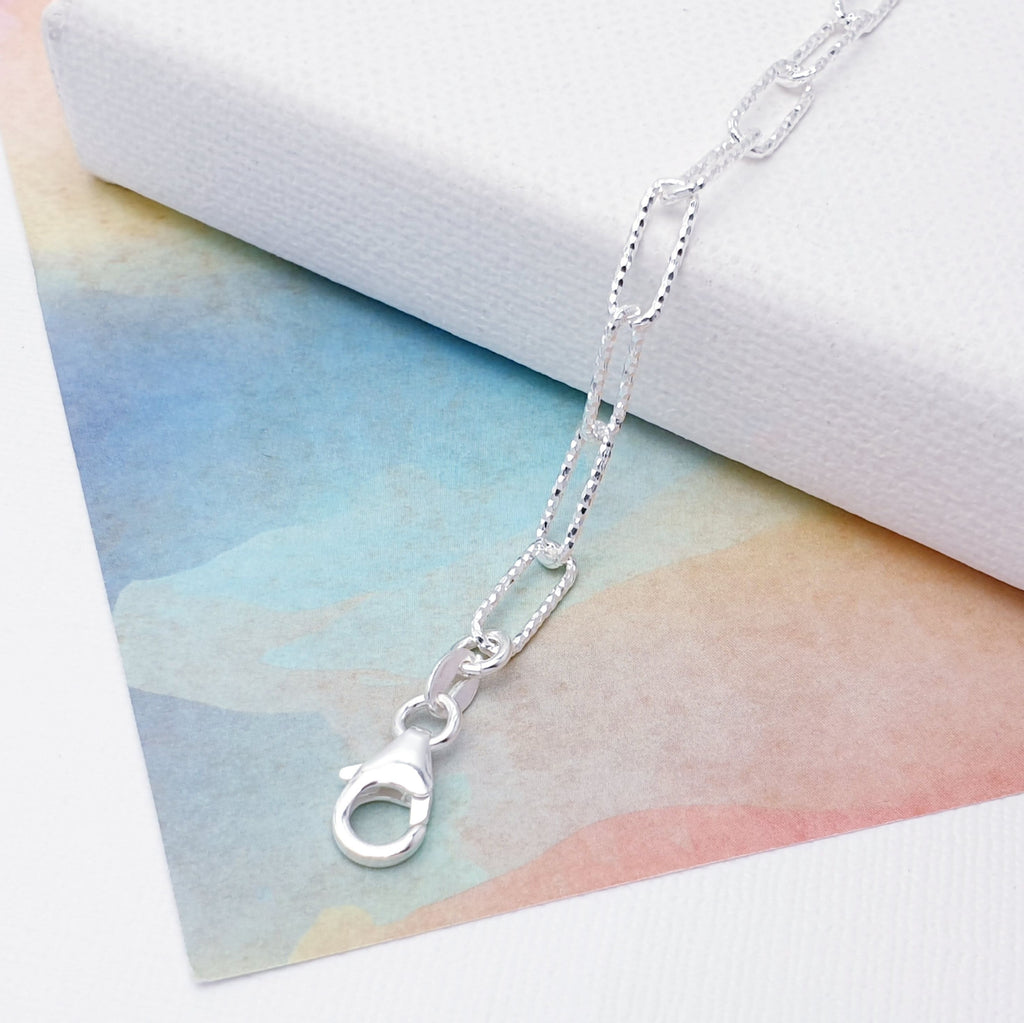 Our beautiful Sterling Silver Hammered Paperclip Link Bracelet is perfect for everyday wear or special occasions.  This design features hammered, oval links that are connected in a paperclip pattern, creating a beautiful and stylish design. 