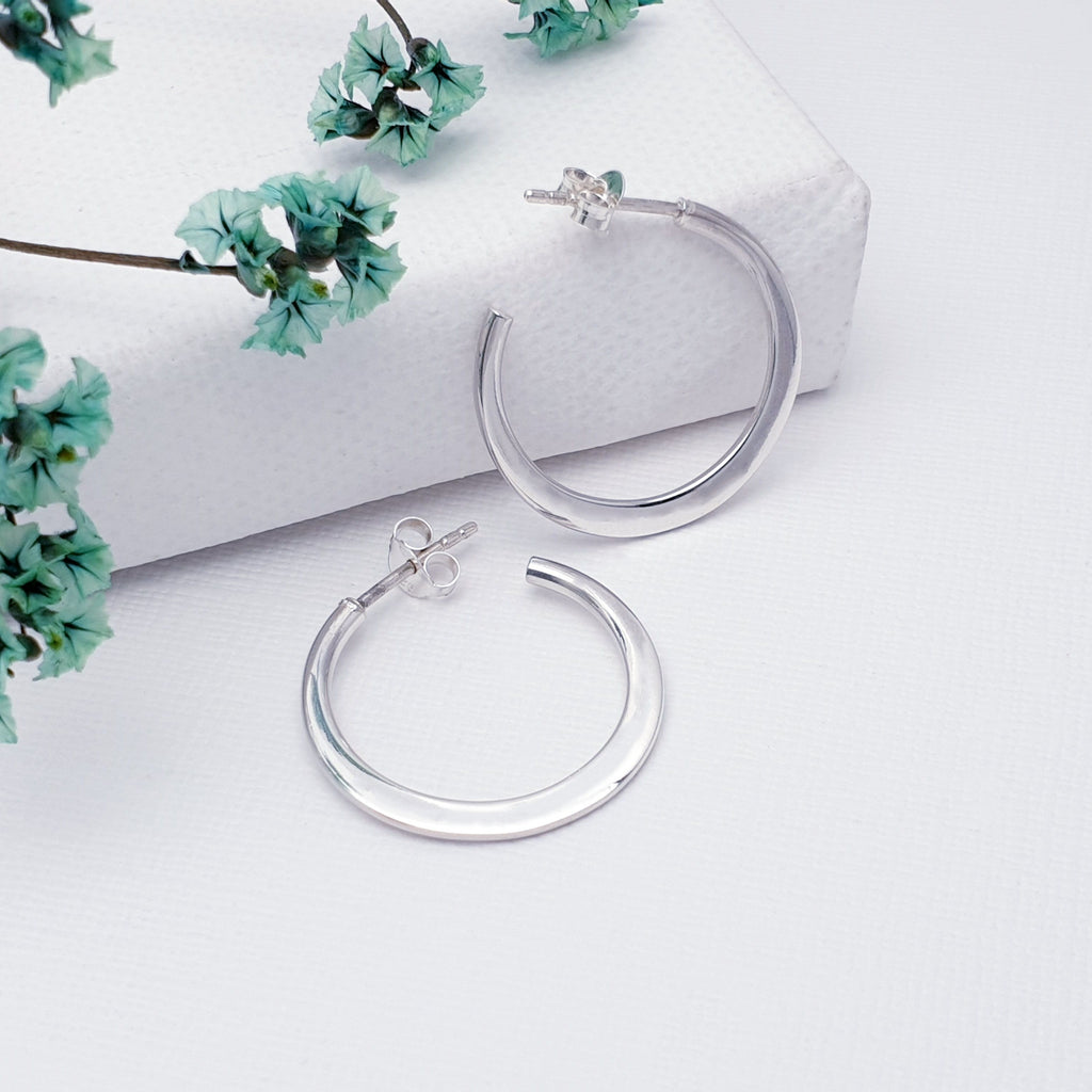 Our Silver Flat Half Hoops are ideal for everyday wear and can transition effortlessly from work to play.  These simple flat design half hoops have a contemporary feel, are light on the ear and easy to wear. With a stud attachment, these hoops will feel extra secure while you get on with your day and are bound to become everyday favourites.