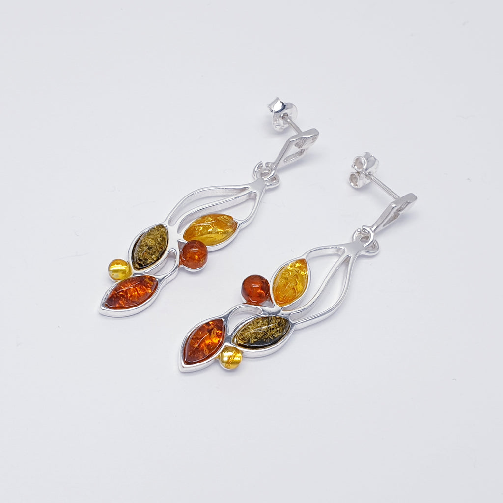 Each earring features three marquise shaped, and two small round mixed Amber Stones. Each stone represents a little leaf on a Sterling Silver hanging vine. This beautiful nature inspired design uses the finest Baltic amber. The Sterling Silver stud fixing make these earrings extra secure so you won't need to worry about loosing them. 