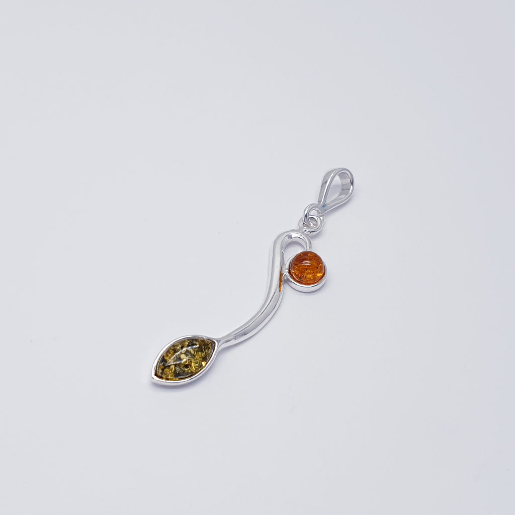 A beautiful design, this pendant features a marquise shape Green Amber stone and a small round Toffee Baltic Amber stone, both in Sterling Silver settings. A silver 'vine' compliments the stones in this gorgeous nature inspired design. 