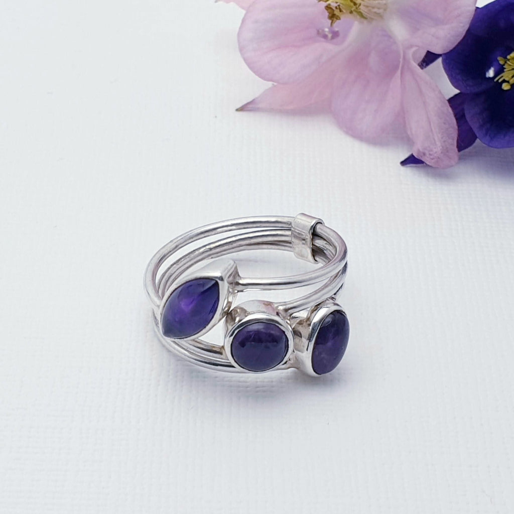 A beautiful design, this ring features three Amethyst stones; marquise, round and oval shaped in simple settings. An elegant fixed stacked design has been crafted in Silver, giving this ring that 'something a little different' we love so much at Silver Scene.