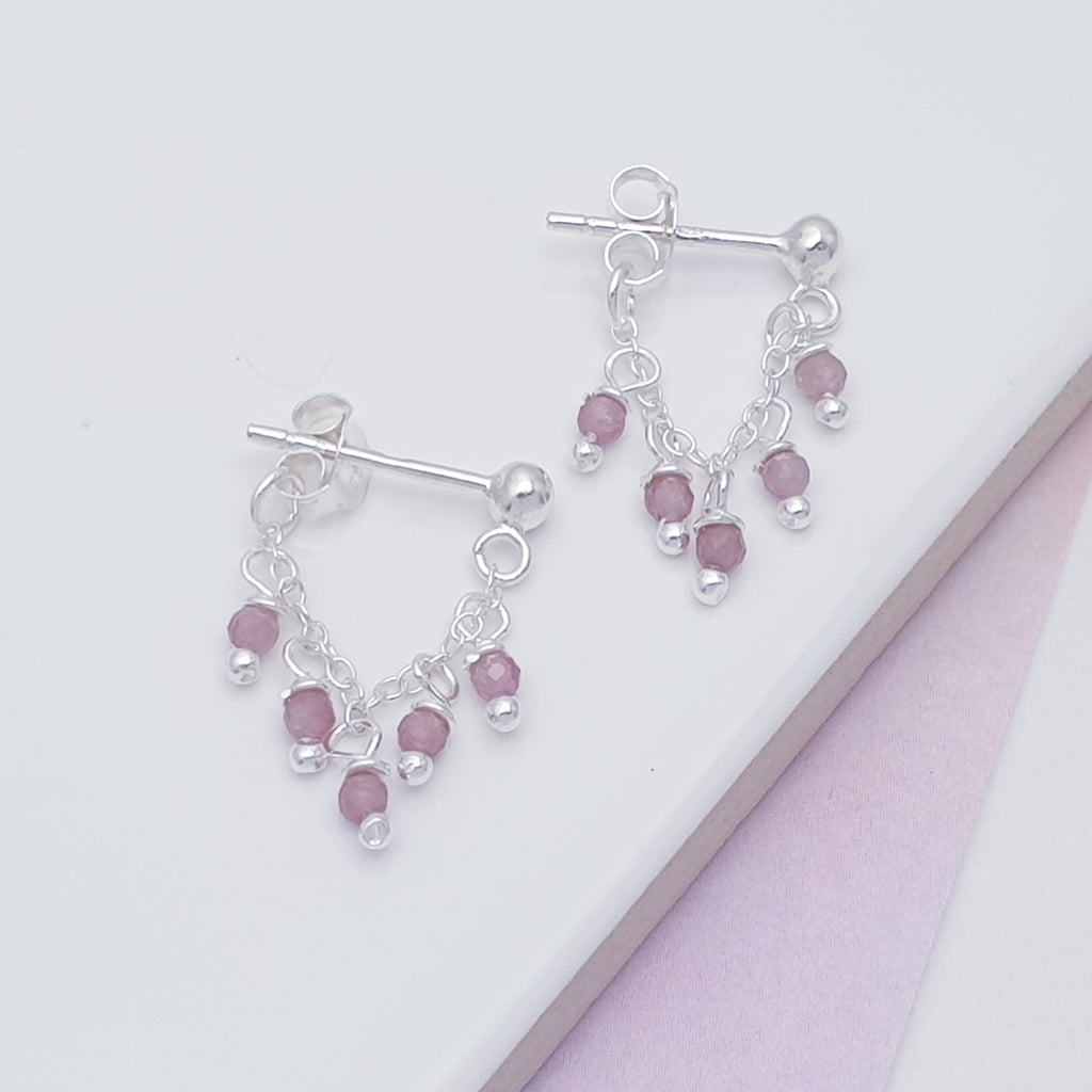 Each earring features five, Pink Tourmaline stone beads, that elegantly hang on a chain, attached to a Sterling Silver stud fastening. A gorgeous and interesting design, these earrings are light on the ear, easy to wear and will soon become everyday favourites.