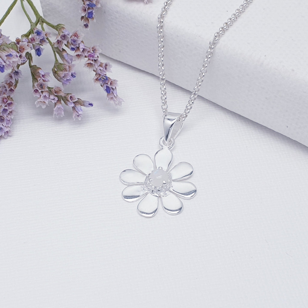 This pendant features a round cabochon Moonstone. The Moonstone is highlighted by decorative Silver petals creating a detailed daisy.  A beautiful little pendant, this is bound to become an everyday favourite