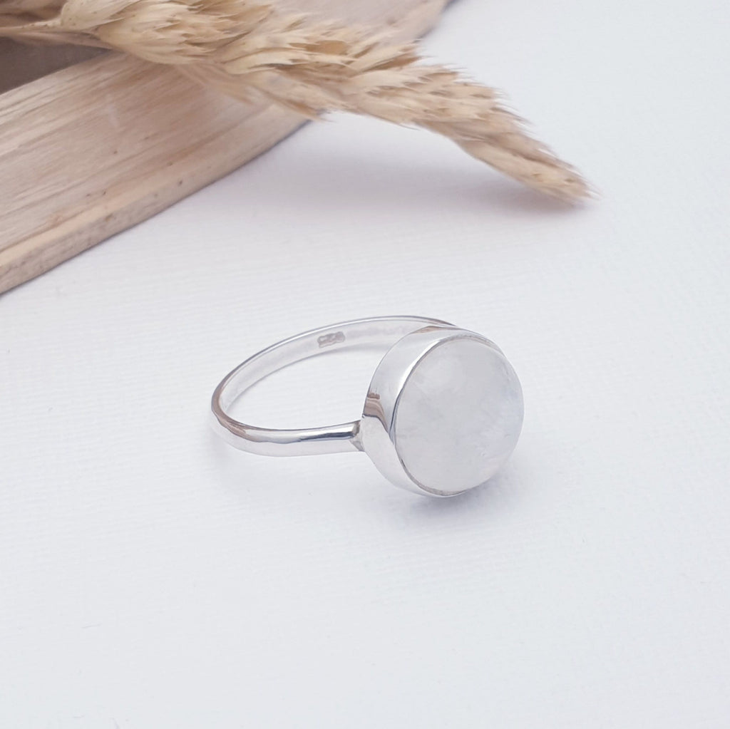 A beautiful simple design, this ring features a round cabochon, Moonstone in a simple setting on a sturdy band. This understated design will become your everyday favourite.