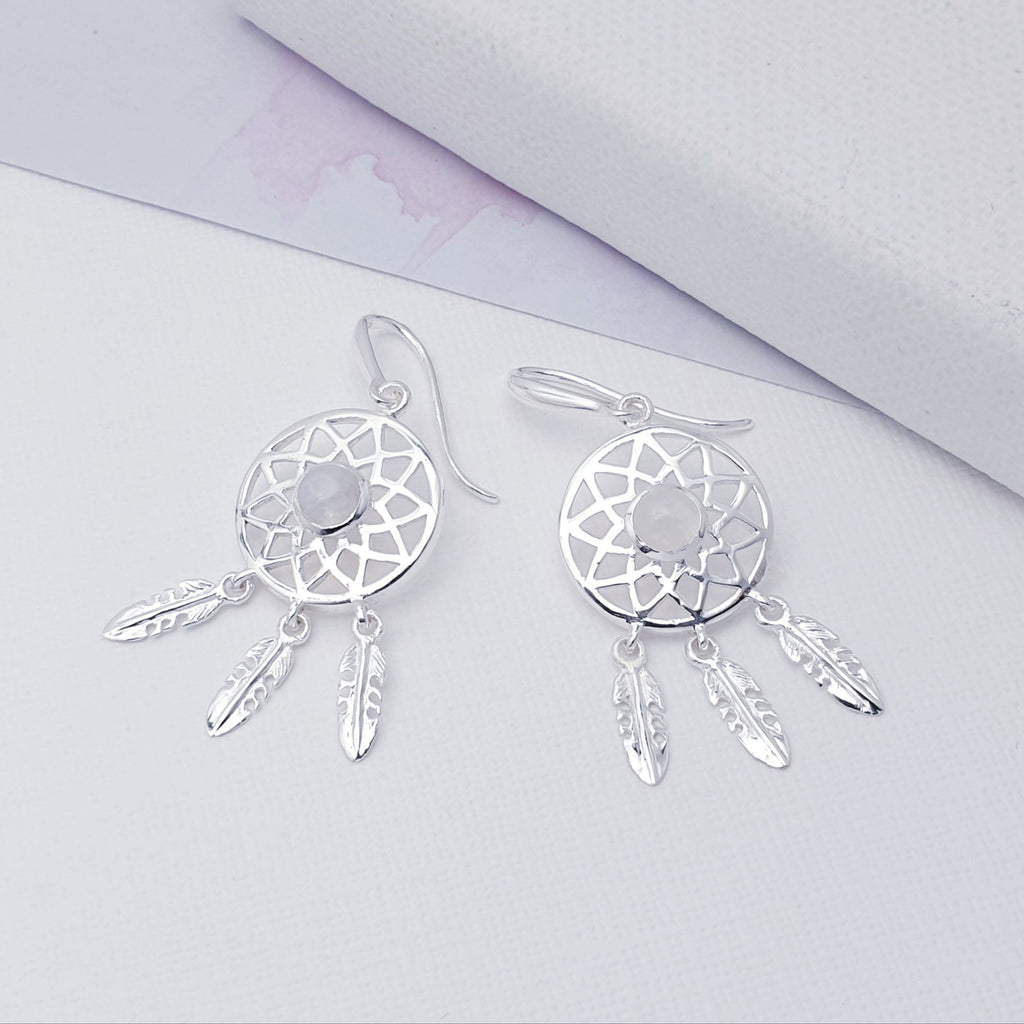 Our Moonstone Sterling Silver Dream Catcher Earrings are perfect for everyday wear or special occasions.  These stunning earrings features small, cabochon Moonstone's in the center of a beautifully detailed dream catcher, with three dangly feathers