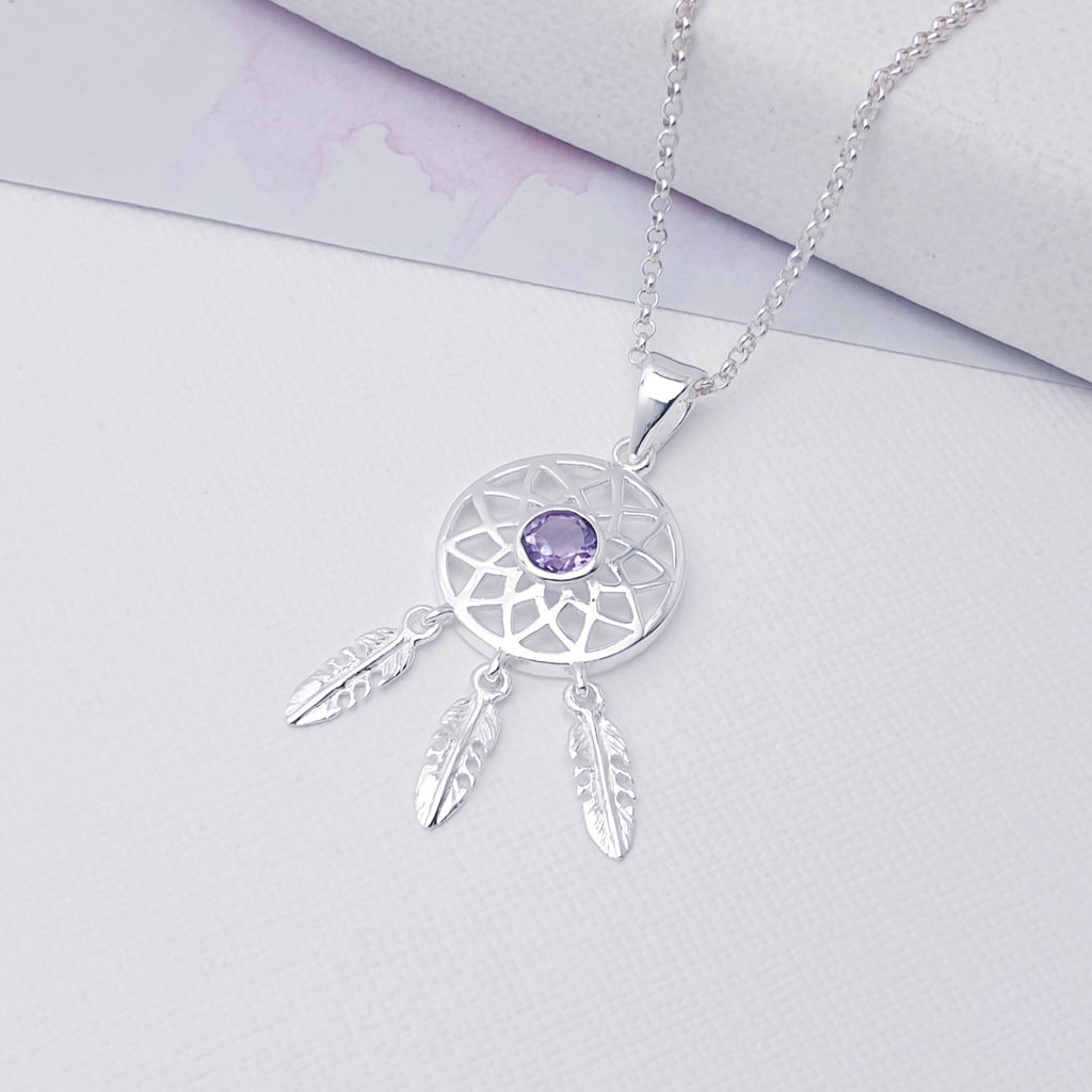 Our Amethyst Sterling Silver Dream Catcher Pendant (chain not included) is so cute as would be and perfect for everyday wear.  This stunning pendant features small, cabochon Amethyst in the center of a beautifully detailed dream catcher, with three dangly feathers. 