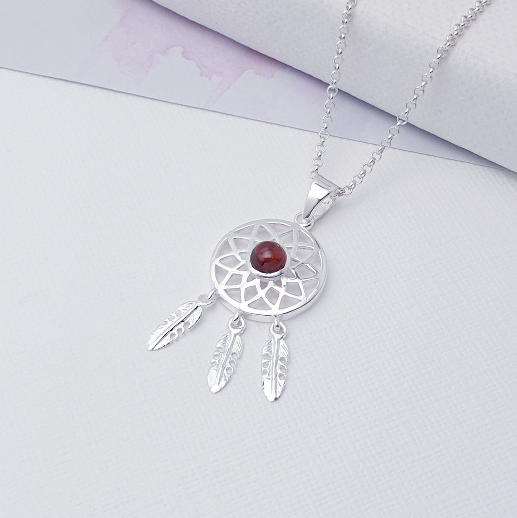 Our Garnet Sterling Silver Dream Catcher Pendant (chain not included) is so cute as would be and perfect for everyday wear.  This stunning pendant features small, cabochon Garnet in the center of a beautifully detailed dream catcher, with three dangly feathers.