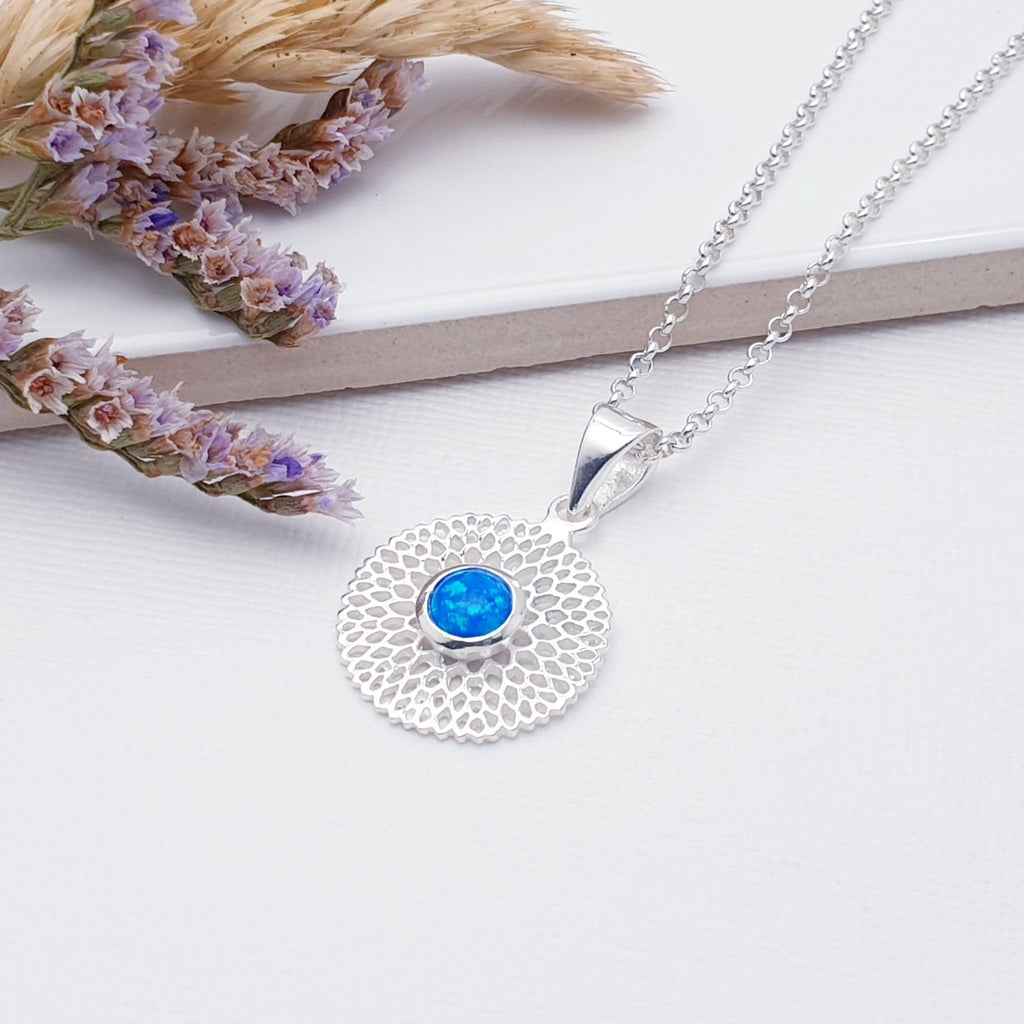 Our Reconstituted Opal Sterling Silver Chrysanthemum Pendant (chain not included) is so cute and would be perfect for everyday wear.  This stunning pendant features a small, cabochon Reconstituted Opal in the center of a beautifully detailed flower.