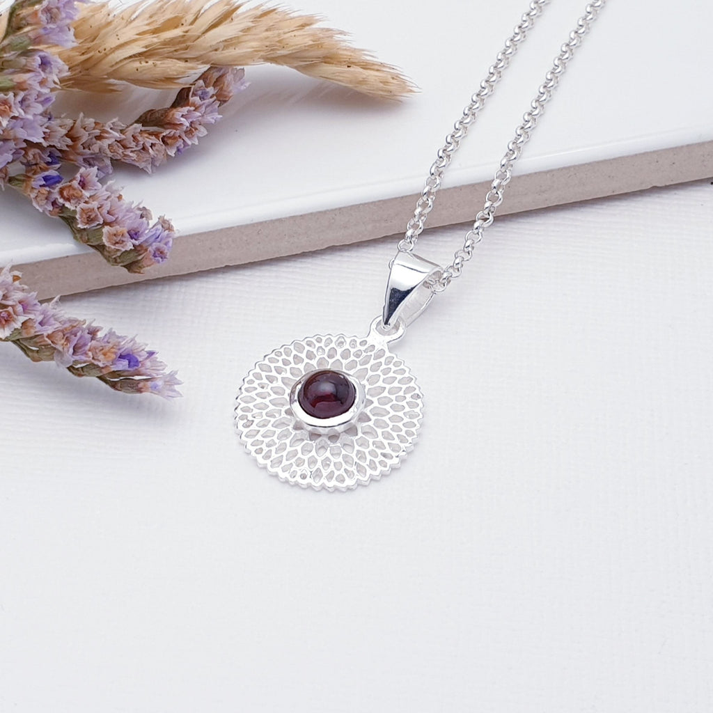 Our Garnet Sterling Silver Chrysanthemum Pendant (chain not included) is so cute and would be perfect for everyday wear.  This stunning pendant features small, cabochon Garnet in the center of a beautifully detailed flower.