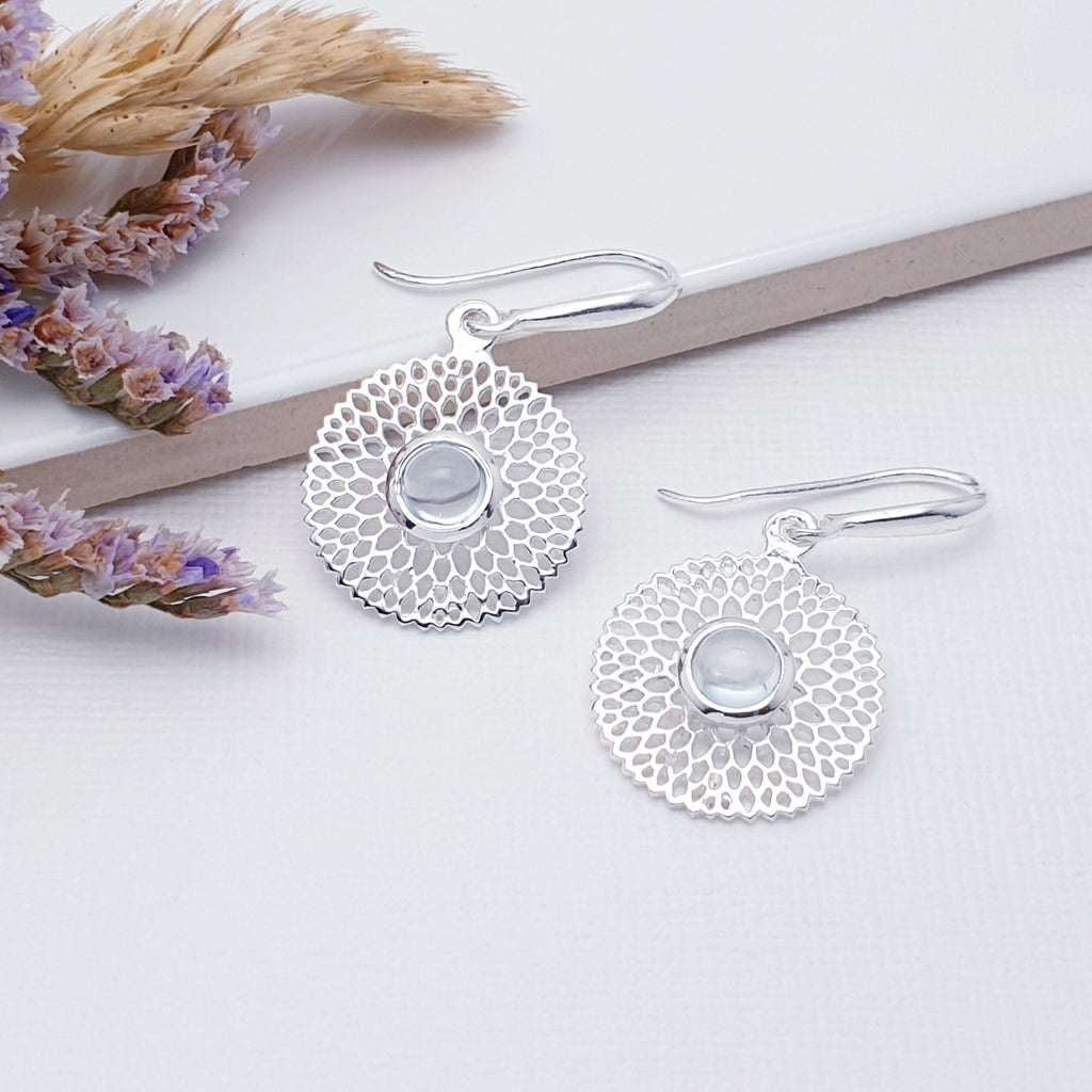 Our Blue Topaz Sterling Silver Chrysanthemum Earrings are so cute and would be perfect for everyday wear.  These stunning earrings feature small, cabochon Moonstone's in the center of a beautifully detailed flower. 