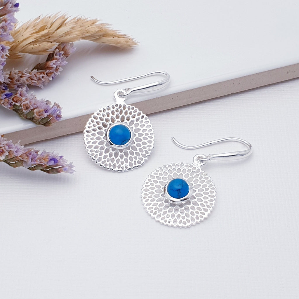 Our Turquoise Sterling Silver Chrysanthemum Earrings are perfect for everyday wear or special occasions.  These stunning earrings feature small, cabochon Moonstone's in the center of a beautifully detailed flower. 