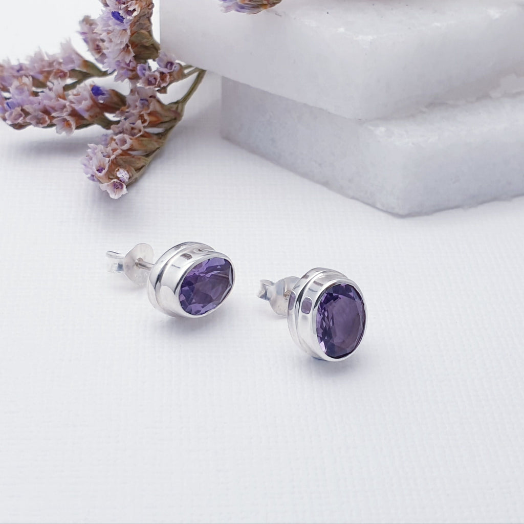 Our Amethyst Oval Studs are perfect for everyday wear.  Sometimes less is more, and that is definitely the case with this gorgeous pair of Amethyst studs. Featuring oval, table top cut, Amethyst stones in simple Sterling Silver settings, you just can't go wrong with this stunning pair of studs.